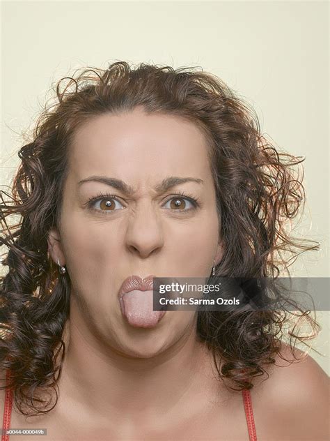 Woman Sticking Out Tongue High Res Stock Photo Getty Images