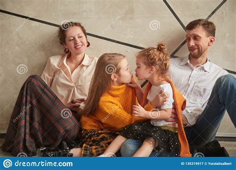 Portrait Of Two Little Sisters With Their Parents Stock Image Image