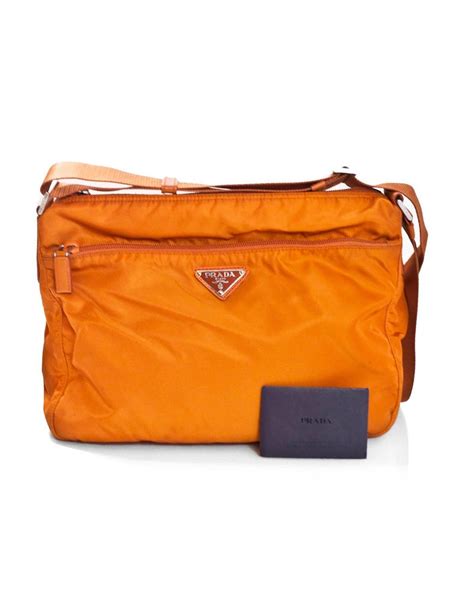 Made in the quilted style that makes it feel more homely, this soft nylon bag will provide many uses for years to come. Prada Orange Tessuto Nylon Messenger Crossbody Bag For ...