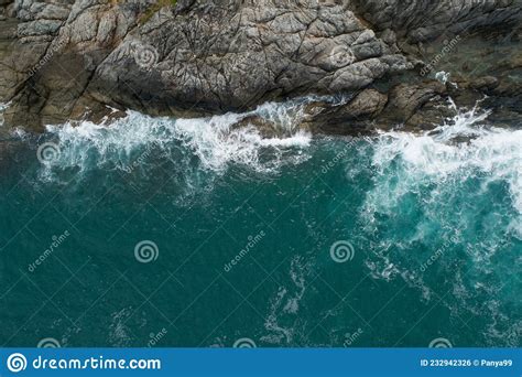 Aerial View Of Sea Crashing Waves White Foaming Waves On Seashore Rocks