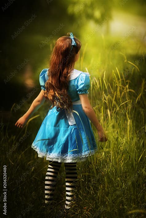 Alice In Wonderlandlittle Girl In Costume Alice In Wonderland Stock