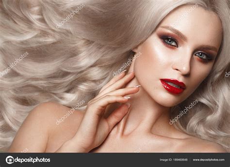 Beautiful Blonde In A Hollywood Manner With Curls Natural Makeup And Red Lips Beauty Face And