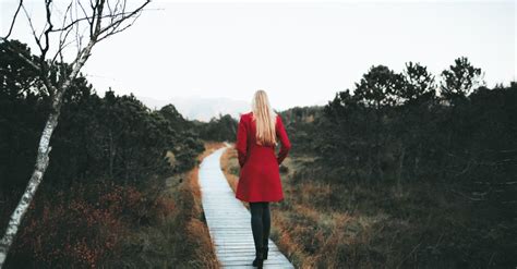 Woman Walking On Wooden Pathway · Free Stock Photo