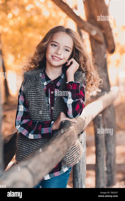 Beautiful Teenage Girl 12 14 Year Old Posing Outdoors Wearing Fur Vest Checkered Shirt