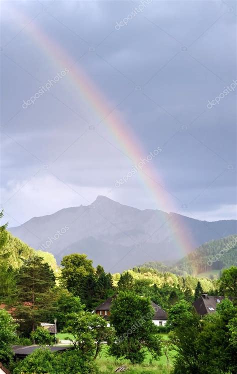 Colorful Rainbow Over The Mountains — Stock Photo © Sorokopud 50265337