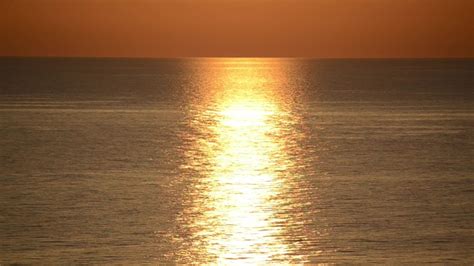 Seascape With Sun Setting Over The Waters Image Free Stock Photo