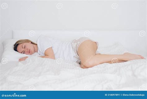 Young Beautiful Girl Sleeping In Bed On White Bedding Woman Close Up