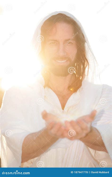 Jesus Christ Smiles From Heaven With Arms Outstretched In Light Stock