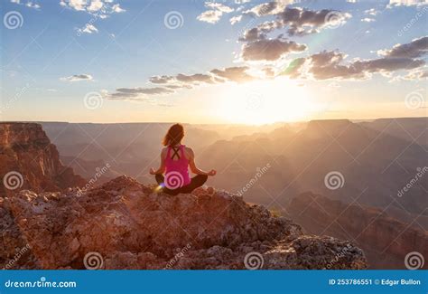 Adventurous Traveler Woman Doing Meditation On Desert Rocky Mountain