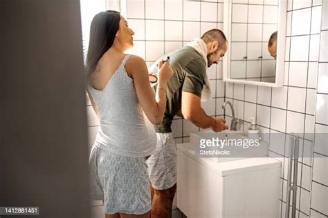 wife in bathroom photos and premium high res pictures getty images