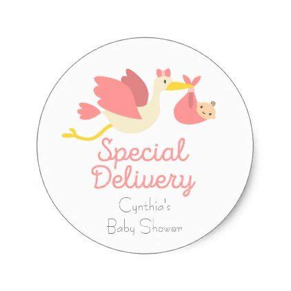 A Round Sticker With A Stork Carrying A Baby In It S Belly