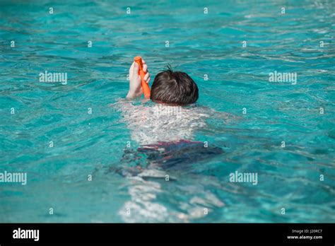 Boy Swimming With Snorkel In Swimming Pool Stock Photo Alamy