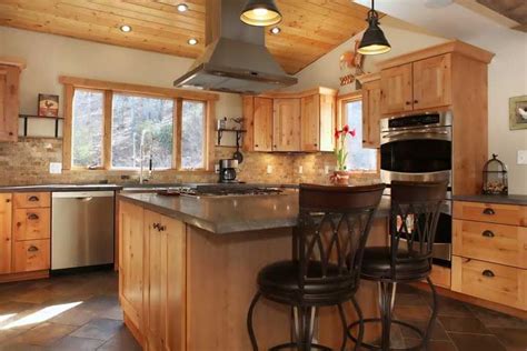 Imagine the possibilities of maximizing your space and getting your custom rta cabinet project so dialed in that you can reduce or eliminate all the unused and wasted space. Love the beautiful, natural-looking maple wood cabinets in this rustic kitchen. #interiordesign ...