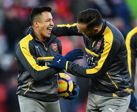 alexis sanchez spotted laughing after being benched for arsenal s match with liverpool daily star