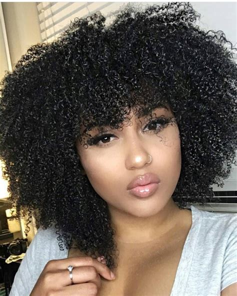 To style your hair after every wash you will need to use some gel, serum or hair care products to keep your wavy hair, and then scrunched them and wait for them to dry naturally or use a hair dryer. Charming 10 Black Natural Hairstyles with Bangs for Women ...