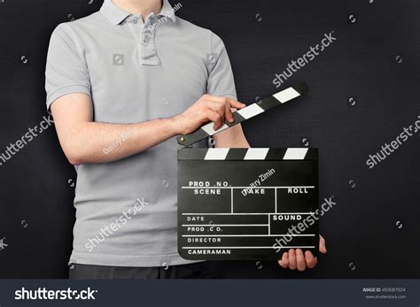 Young Man Holding Clapper Board Isolated Stock Photo 493087024