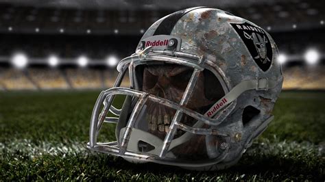 Raiders Old Helmet With Human Skull On Grass Field Hd Raiders