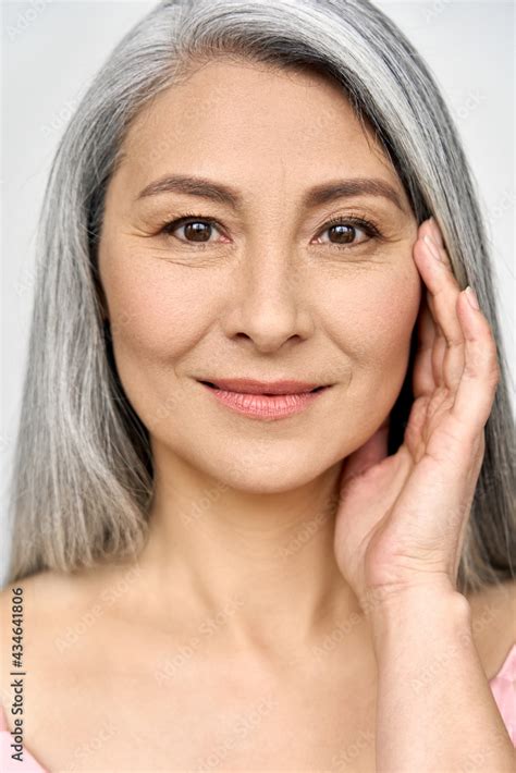 closeup portrait of gorgeous happy middle aged mature asian woman senior older 50 year lady
