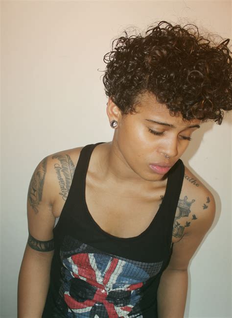 Awesome androgynous cut on curly hair. Love her style. Love the hair. Totally awesome ...