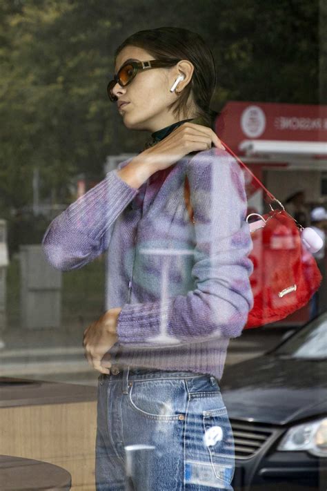 Kaia Gerber Steps Out In A Cropped Purple Cardigan And Jeans During Milan Fashion Week In Milan