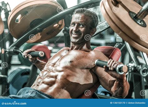 Brutal Aged Strong Bodybuilder Athletic Men Pumping Up Muscles With