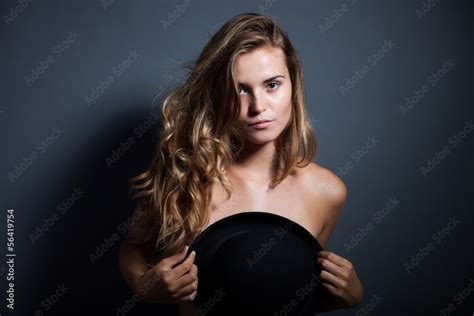 Naked Woman Covering Breasts With Hat Stock Photo Adobe Stock