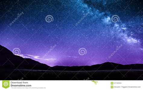 Night Sky Stars With Milky Way Over Mountains Italy Stock Photo