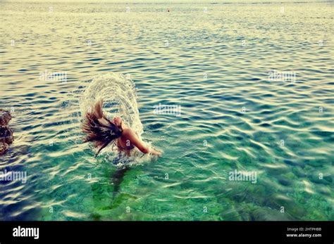 Girl Splashing With Hair In Sea Beauty Model Girl Splashing Water With