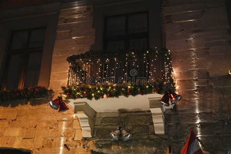 Decorated Building Balcony With Christmas Branches Warm Lights Jingle