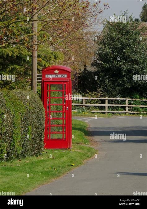 Public Phone Booth By Road And Trees Stock Photo Alamy