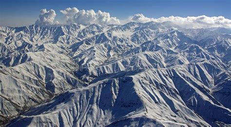 Rugged Afghanistan Mountain Range A Majestic Snow Covered Mountain
