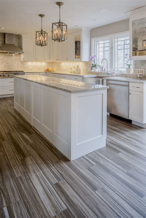 Laminate cabinets with a basic boxy shape benefit from dimensional embellishments such as molding around the door faces and cabinet tops, or. White Kitchen - Gain inspiration and view Lewis Floor ...