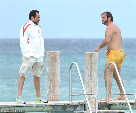 Jude Law Shows Off Paunchy Physique And Strange Facial Hair As He Takes