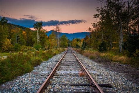 Railroad Track And Distant Mountains At Sunset Seen In White Mountain