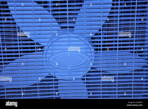 A Blue Fan Blowing Cool Air Stock Photo Alamy
