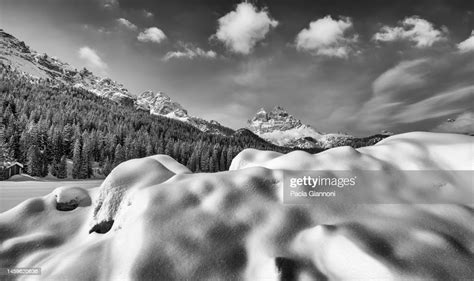 Mountain Peak And Snowy Valley In Winter Season Against A Beautiful