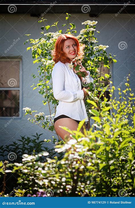 she enjoys the beauty of her garden stock image image of hair beautiful 98774129