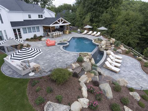 Landscaping Around A Pool With A Slope