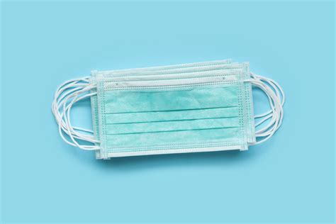 Surgical Face Mask On Blue Background Protection Against Covid 1 The