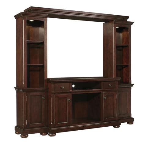 Inspired by the sheer simplicity and weatherworn beauty of primitive furniture, this tv stand brings a relaxed sense of style into your space. W697-120 Ashley Furniture Porter - Rustic Brown Tv Stand