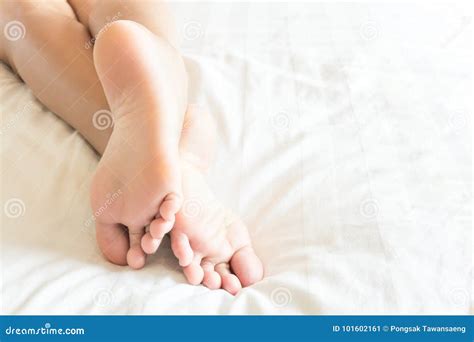closeup woman feet relaxing and happy time on white bed beauty stock image image of health