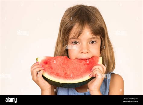 Little Girl Eating Watermelon Isolated On White Background Stock Photo