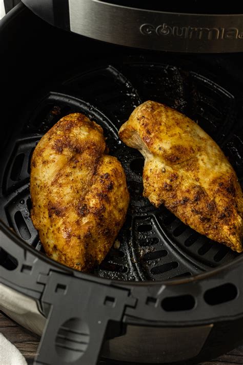 Drizzle the chicken with olive oil and season as desired. Easy Air Fryer Frozen Chicken Breasts - Feeding Your Fam