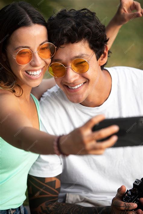 Free Photo Couple Taking A Selfie While Traveling In Summer