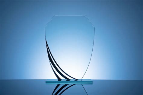 Premium Photo Elegant Blank Glass Shield Trophy On Blue Gradient