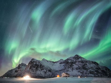Aurora Borealis With Starry Over Snow Mountain Range With Illumination