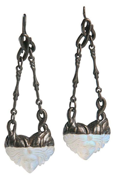 A Pair Of Art Nouveau Silver And Glass Earrings Each Set With A Woman