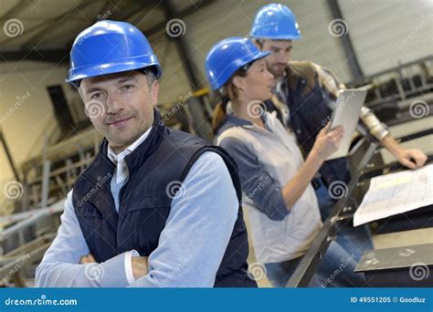 Supervisor In An Industrial Factory With Employees Stock Image Image