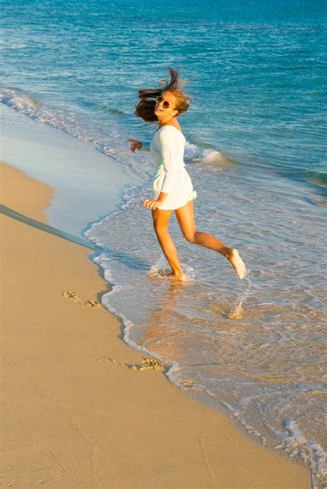 girl runs along the surf line stock image image of long dress 92602605