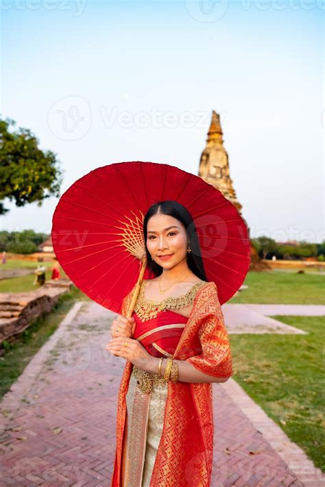 Beautiful Thai Girl In Traditional Dress Costume Red Umbrella As Thai
